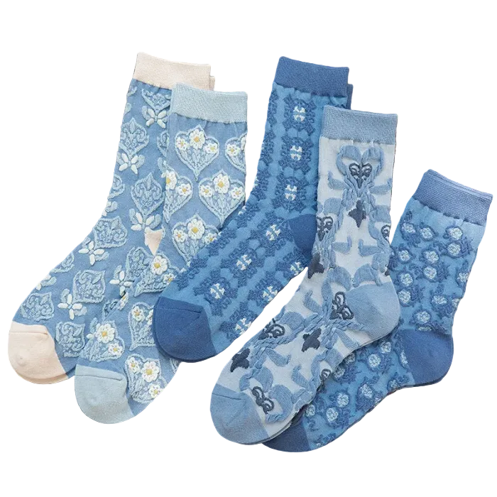 Set of blue patterned socks on a natural background