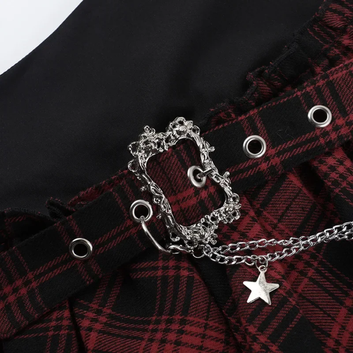 Silver chain belt with star charm on a black and red plaid garment