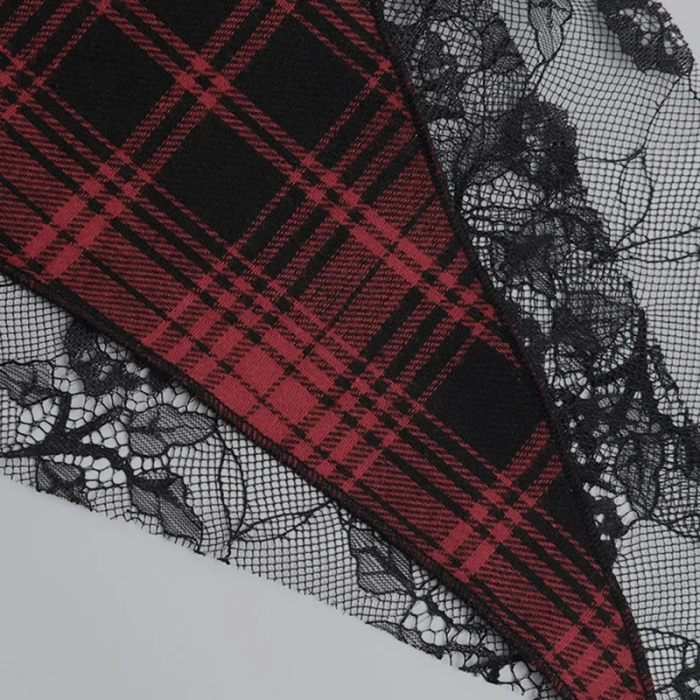 Red and black plaid fabric with black lace on a gray background