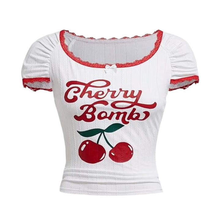 Cherry Bomb Crop Top – Y2K Red Lace Aesthetic Top. White short-sleeve crop top with red lace trim, featuring 'Cherry Bomb' text and a cherry graphic on the front.