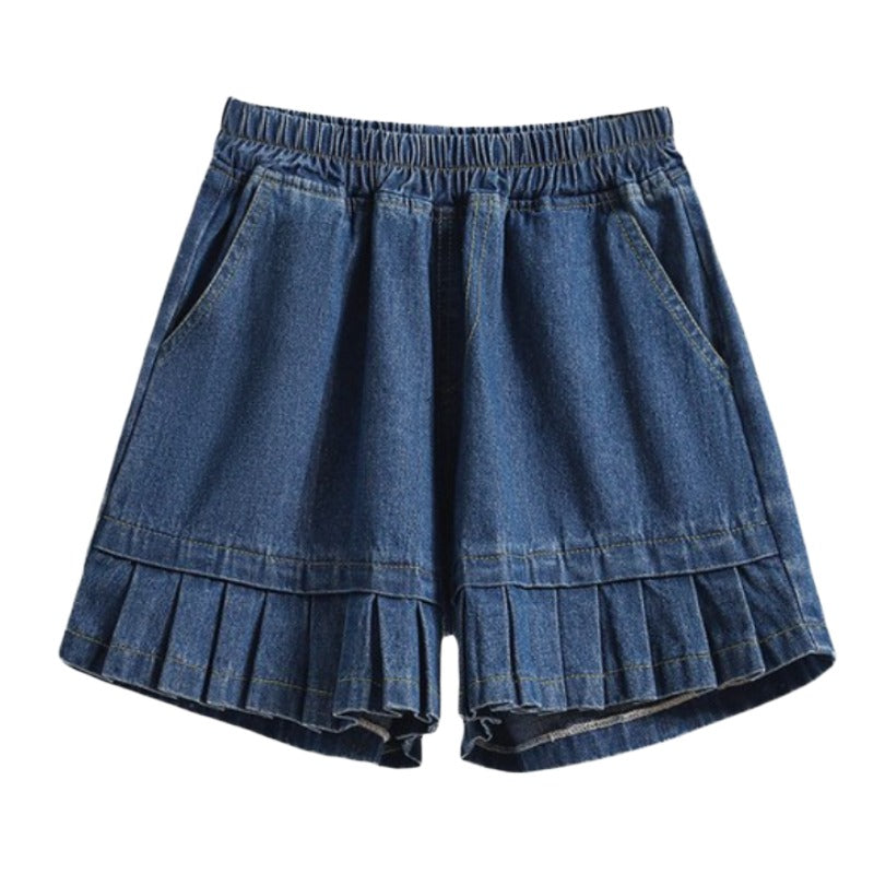 Blue Pleated Denim Shorts – Soft Girl Y2K Aesthetic. Medium wash blue denim shorts with an elastic waistband, side pockets, and a pleated ruffle detail at the hem.