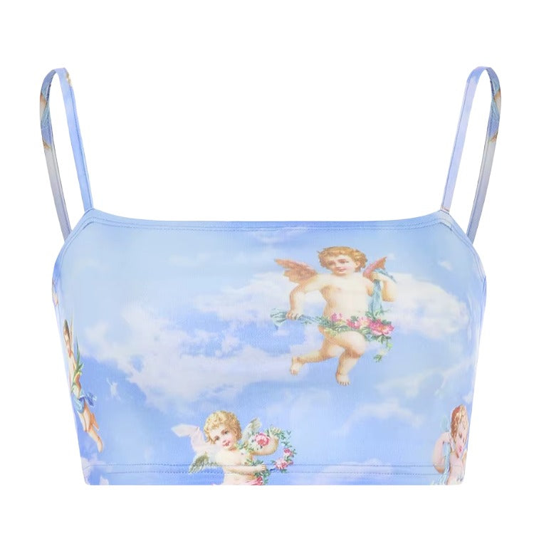 Pastel Blue Cupid Angel Crop Top – Y2K Soft Girl Aesthetic. A light blue camisole top featuring a vintage cherub and cloud print, with thin shoulder straps and a square neckline, shown against a plain white background.