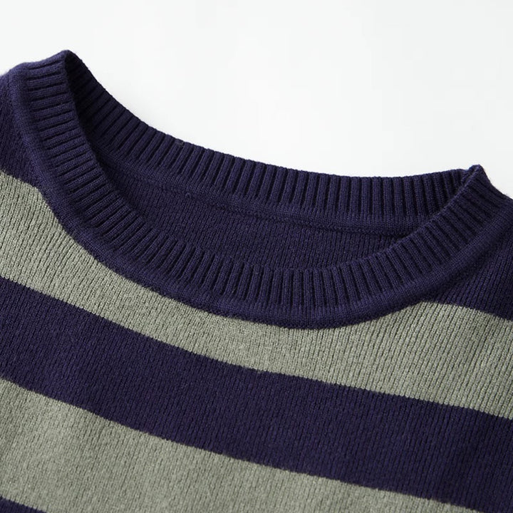 Striped Cropped Knit Sweater – Indie Aesthetic Pullover. Close-up of a striped knit sweater showing a dark navy ribbed crew neck and horizontal navy and light gray stripes.