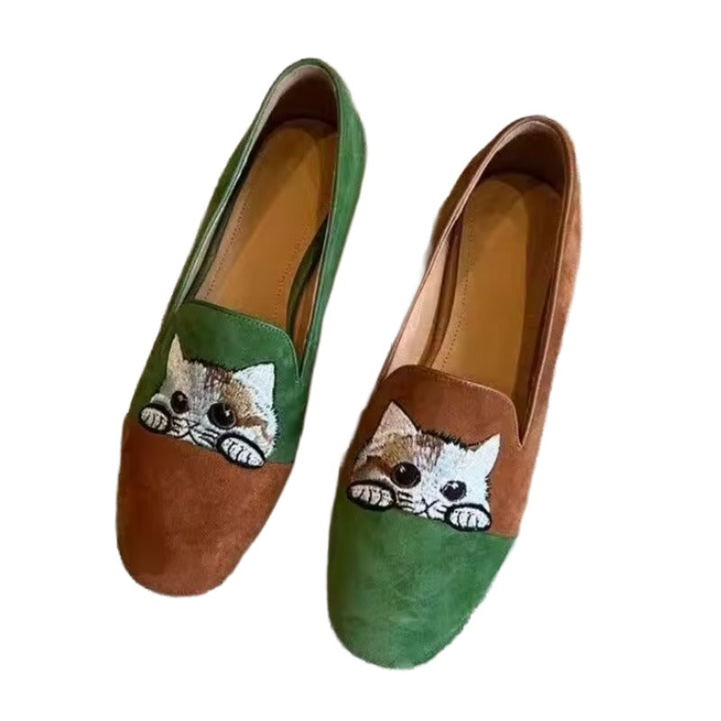 Cute Cat Loafers – Brown Suede Aesthetic Shoes. A pair of slip-on loafers with a split green and brown suede design, featuring cat face on the front of each shoe.